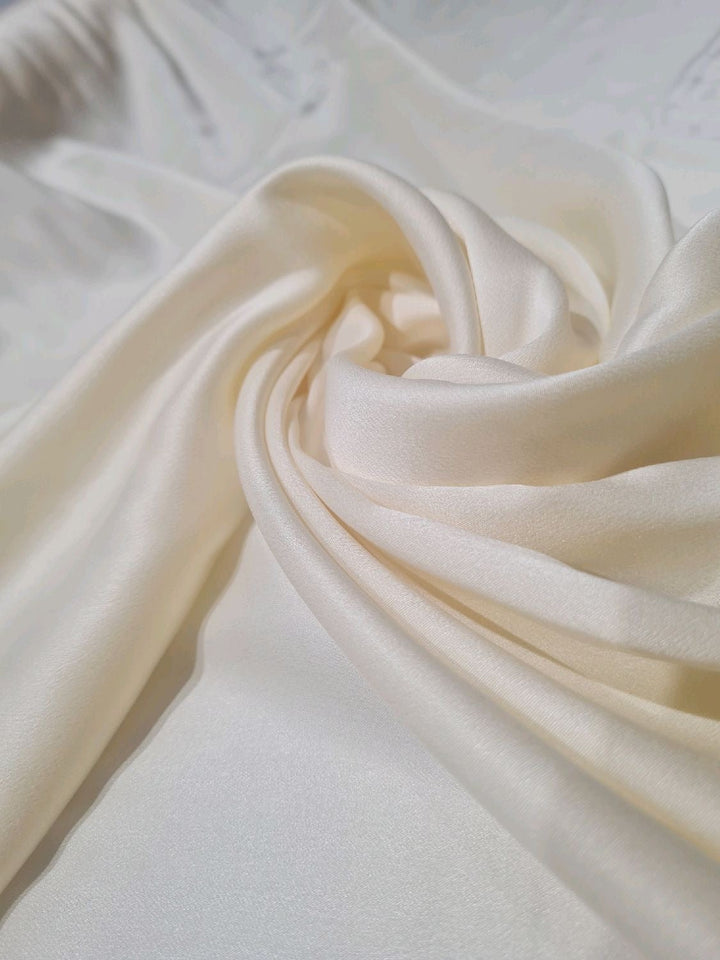 Ivory charmeuse natural silk swirled — the luminous drape of genuine silk for a custom wedding gown