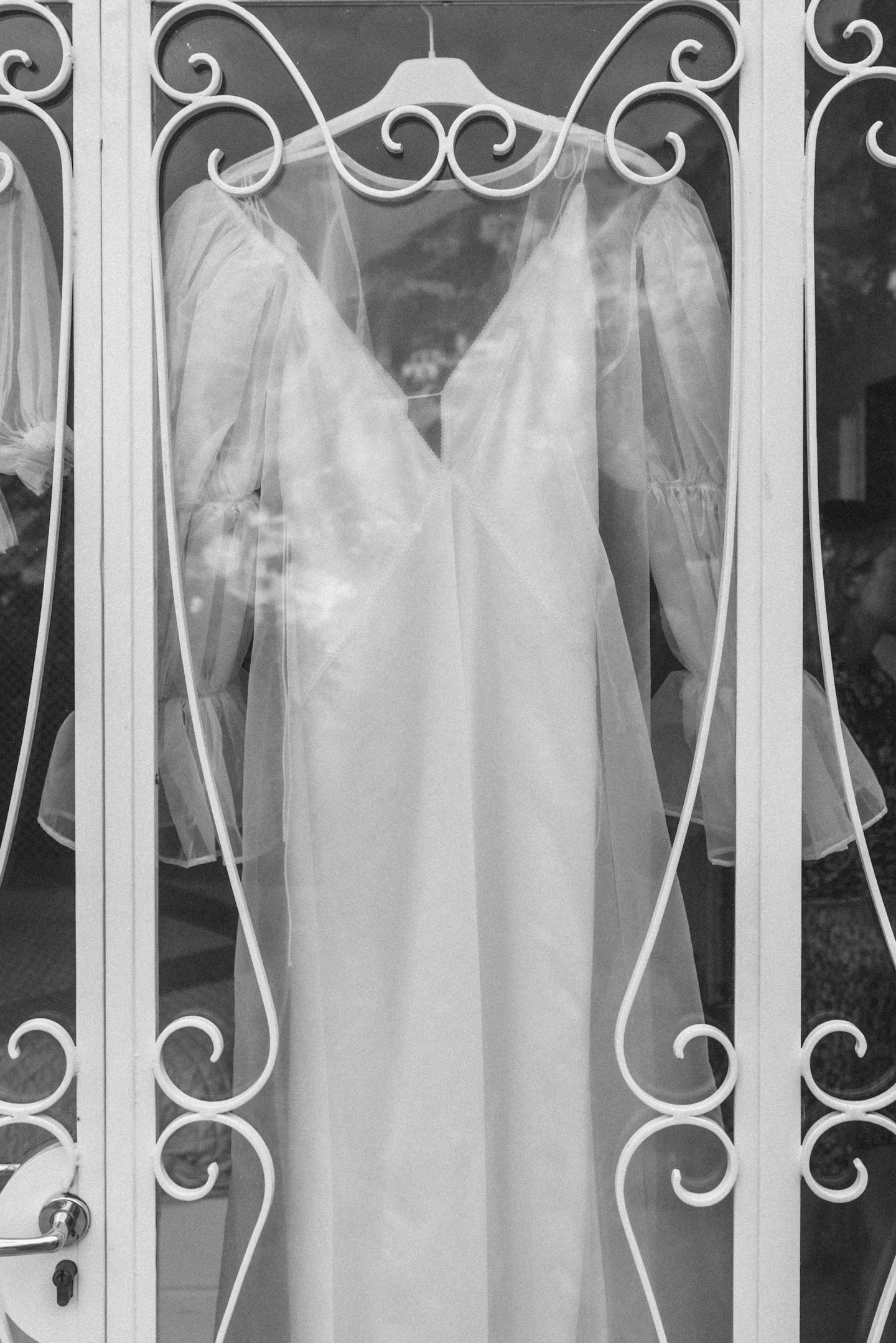 An elegant wedding dress displayed in a boutique window, ready for delivery