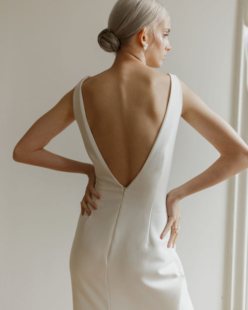 Minimalist mermaid wedding dress with open back