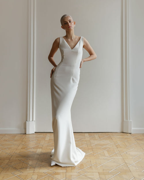 Minimalist mermaid wedding dress with open back