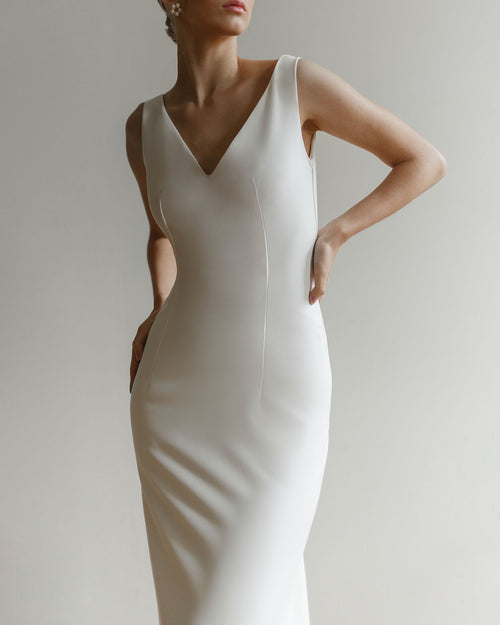 Minimalist mermaid wedding dress with open back