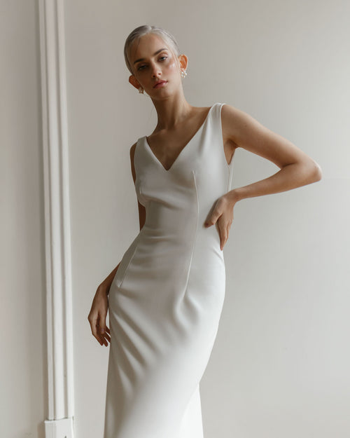 Minimalist mermaid wedding dress with open back
